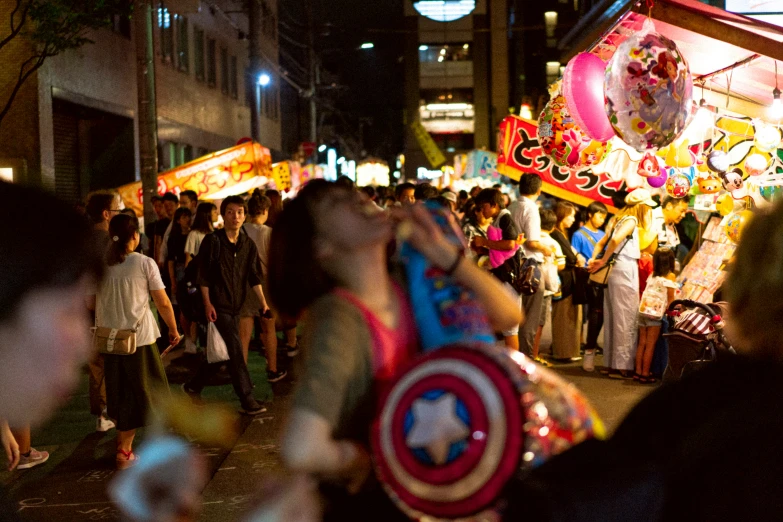 a crowd in the dark at a festival