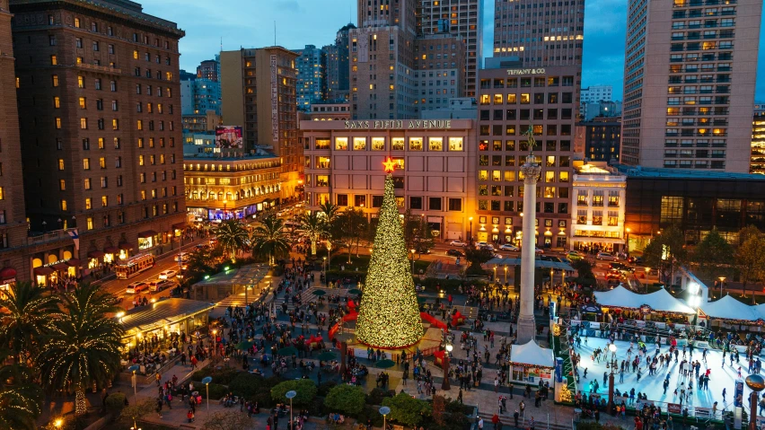 a very large christmas tree with many lights on