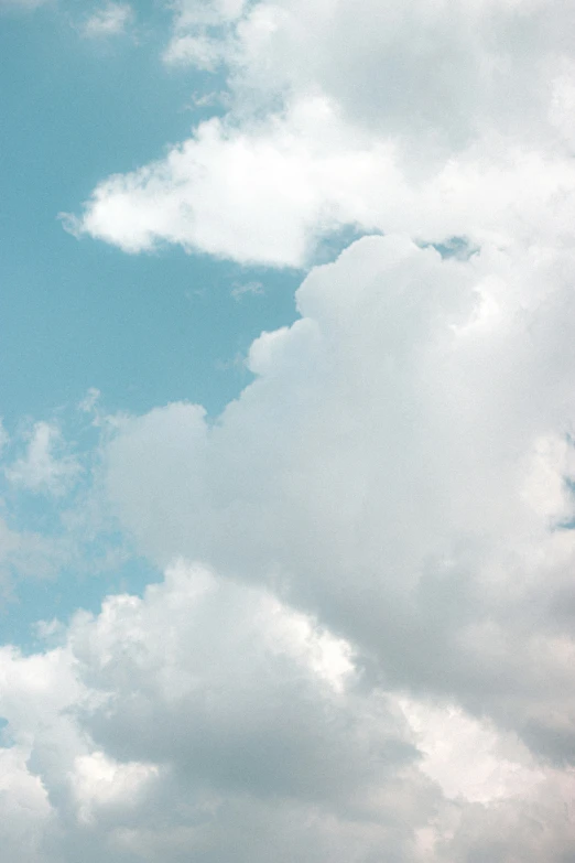 two planes flying through the sky in daytime