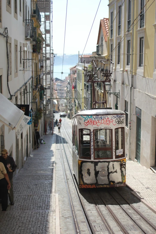 a trolley is going down the street in a small town