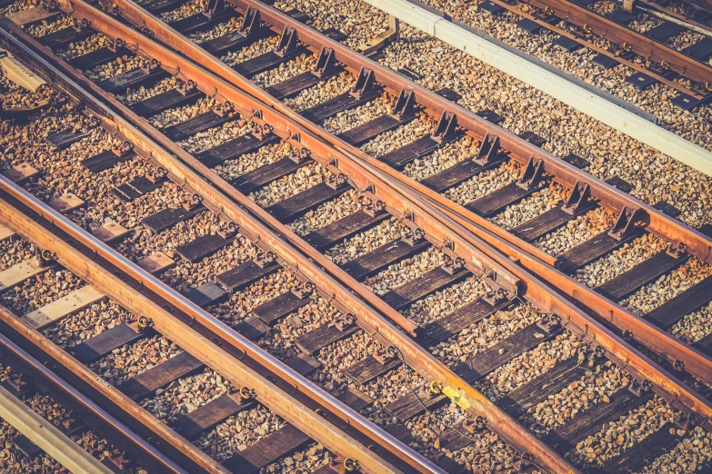 view from above of railroad tracks in sunlight