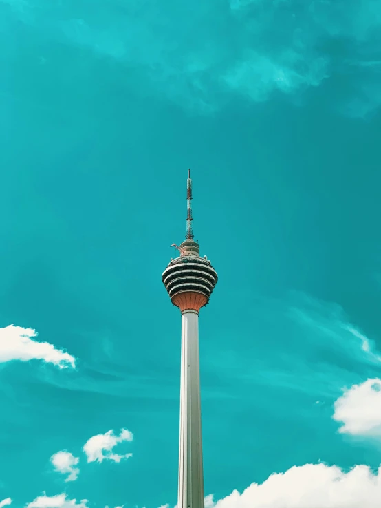 a tall tower with an air traffic control point in it