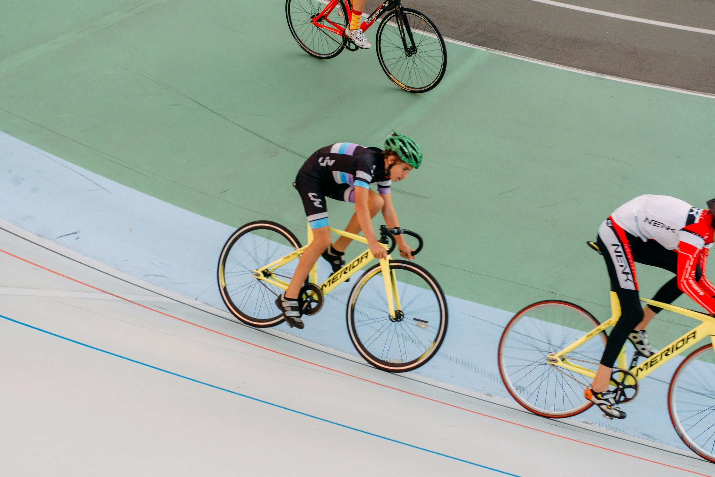 cyclists competing in an indoor track race