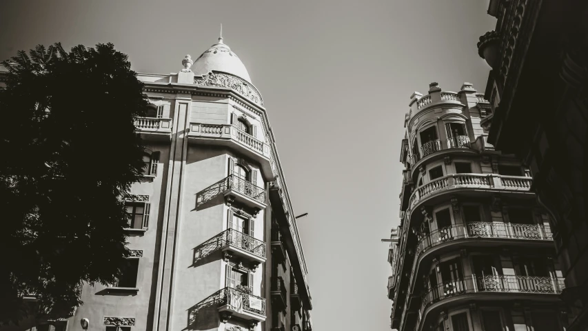 a large apartment building with balconies on the top