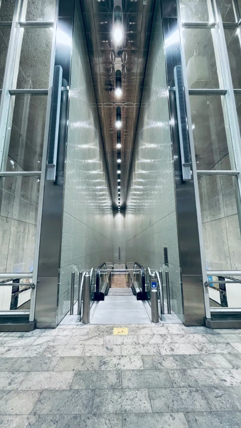 an industrial building with a long hallway to the top