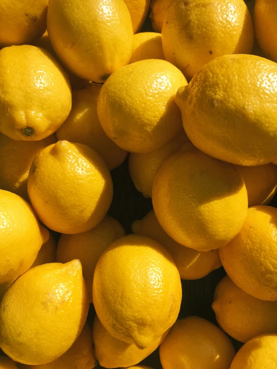 a bunch of lemons that are piled up