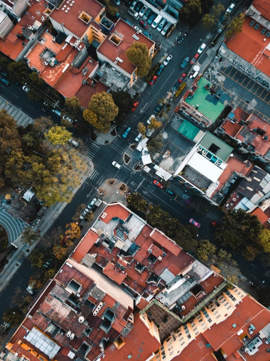 an aerial s of the red roofs of a city