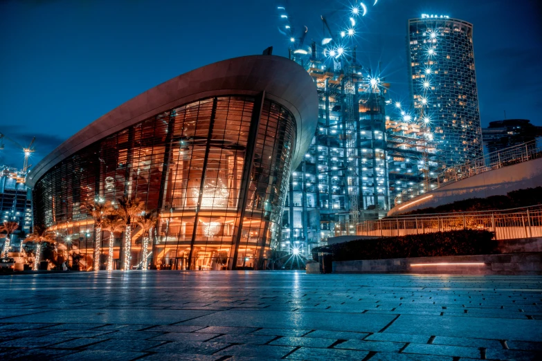 a building in the city at night with many lights