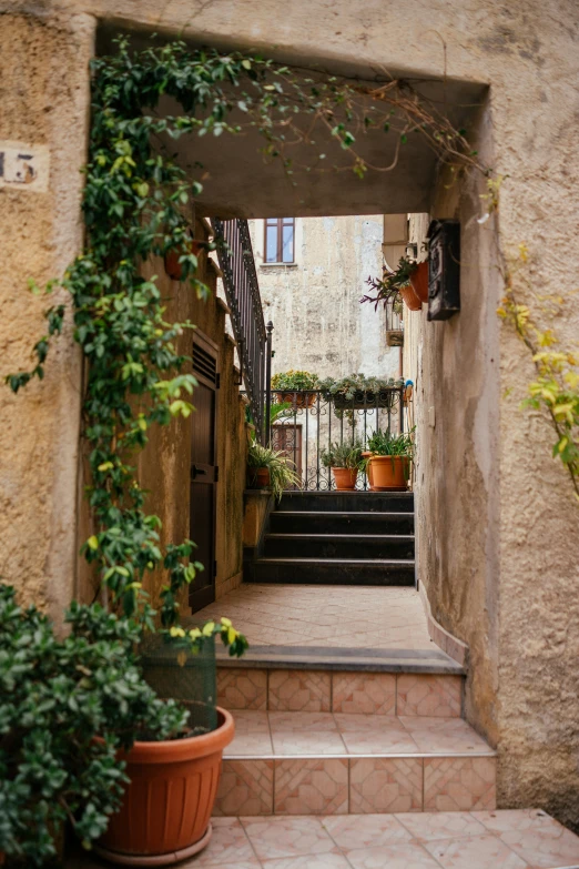 an entrance to a building with stairs that lead down