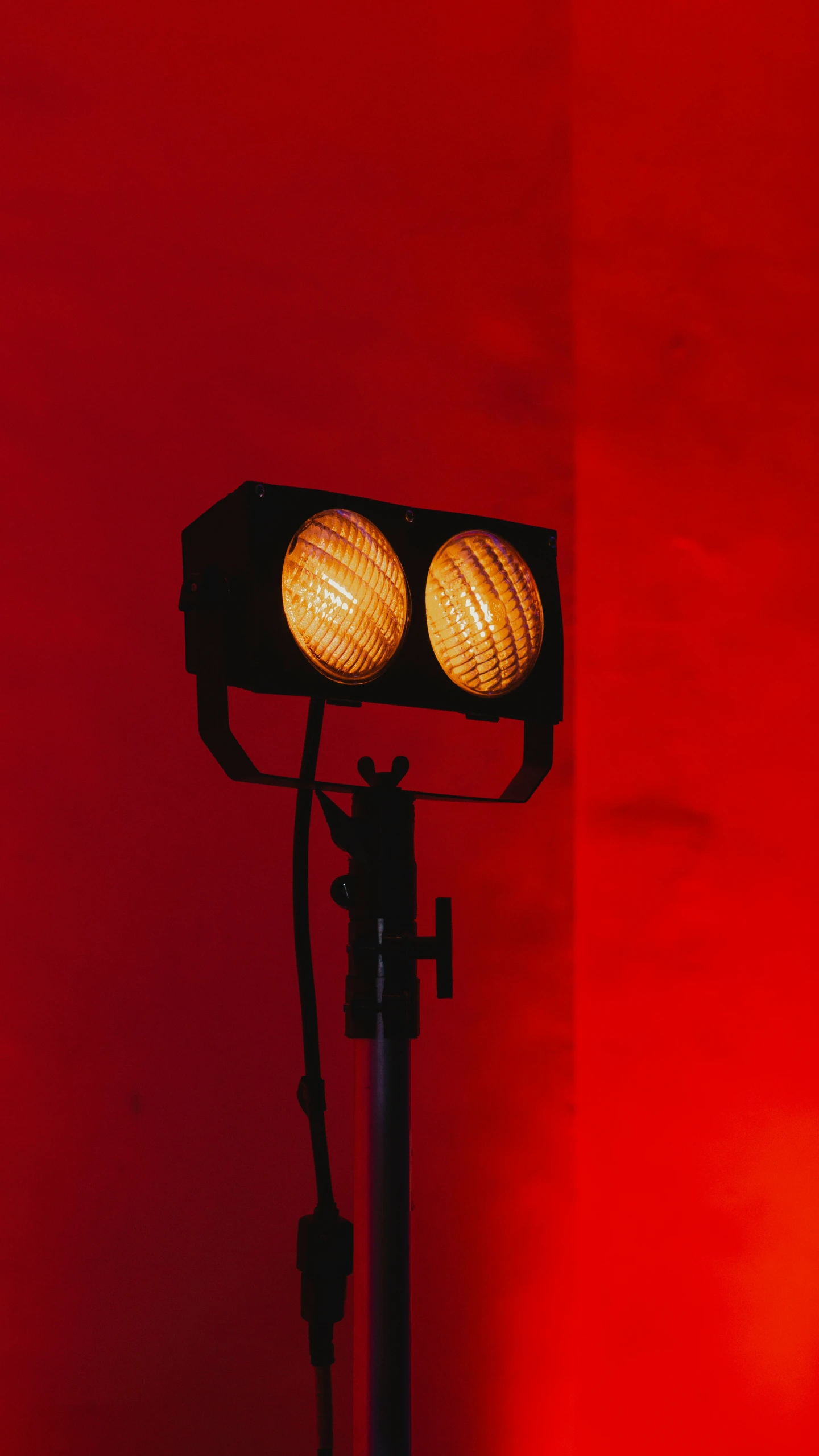 a light that is sitting up against a wall