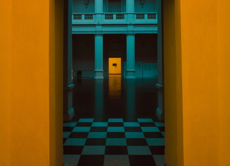 a bright yellow and black door way to an old building
