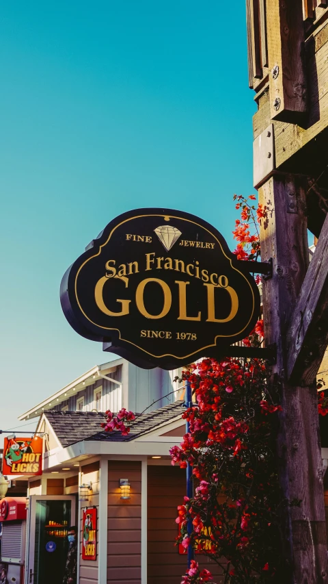 the san francisco gold sign is outside of a building