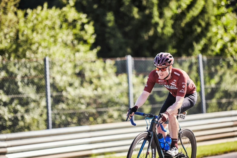 a man is riding a bike on a track