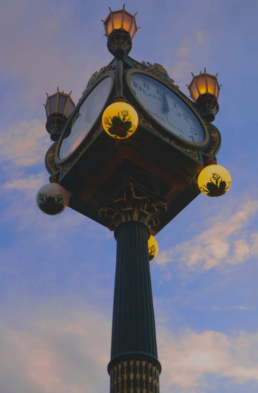 a clock on top of a large pole with several lights