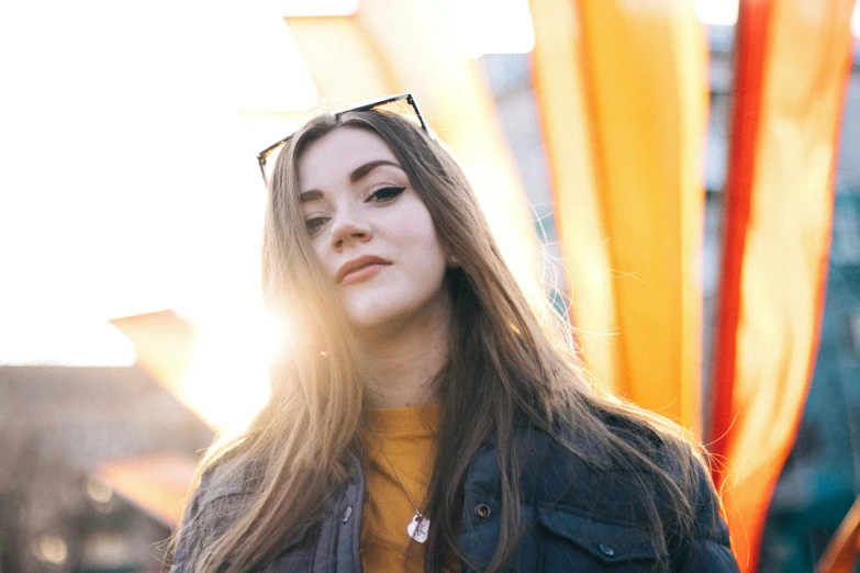 woman wearing glasses and yellow shirt at outdoor event