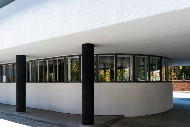 the round building has lots of windows and columns