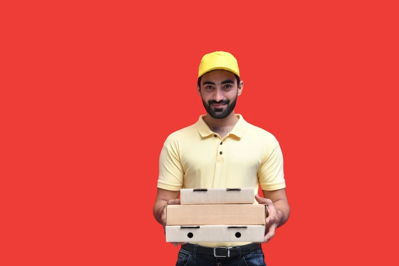 man holding two cardboard boxes in both hands