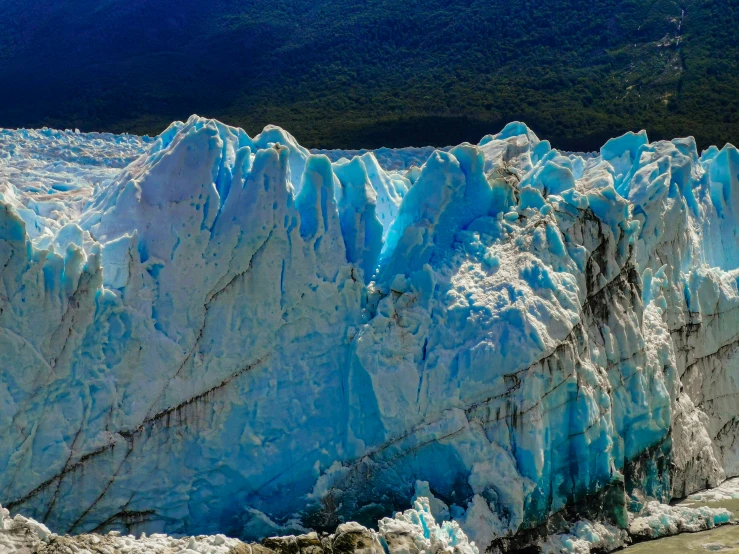 a close up of an ice - covered mountainside