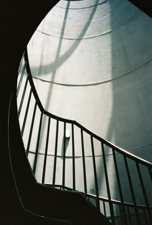 a stair case in a skate park with a handrail