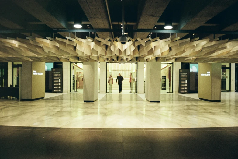 the inside of an empty building with columns and pillars