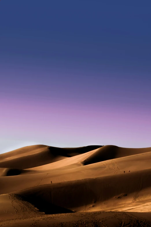a purple sky and a distant desert area