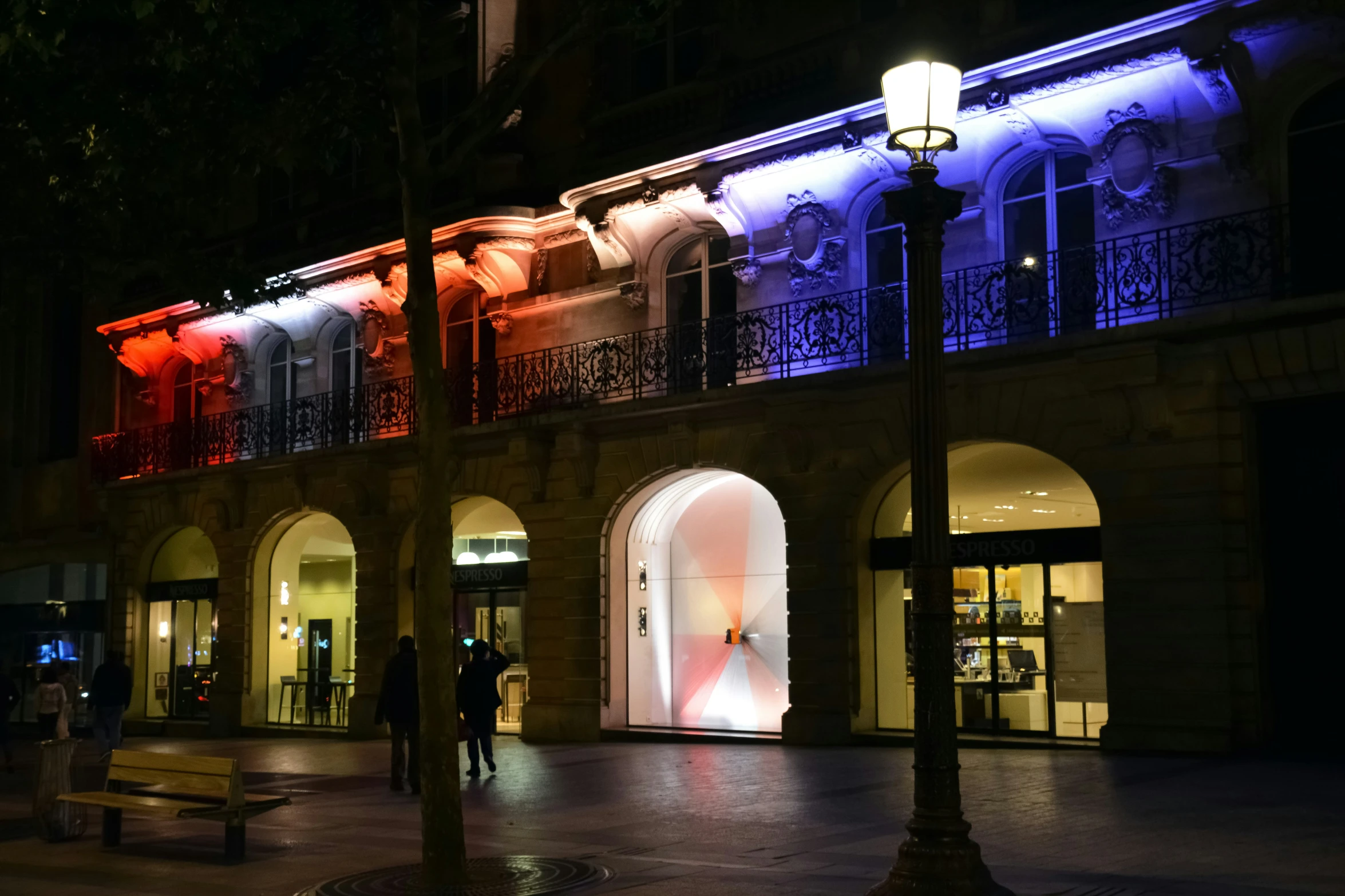 the building lit up is very attractive at night