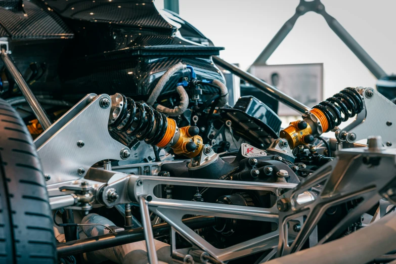 front wheel and suspension of a car on display