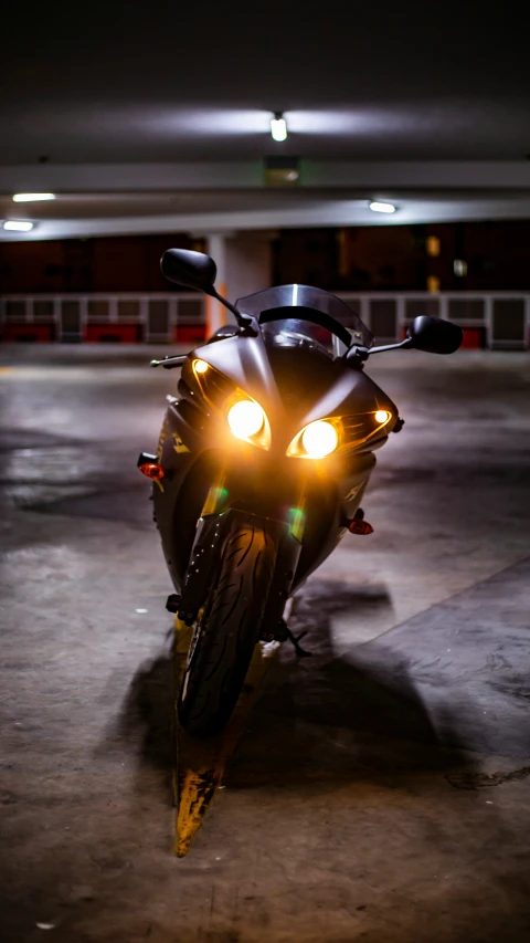 this is a motor cycle sitting in the garage