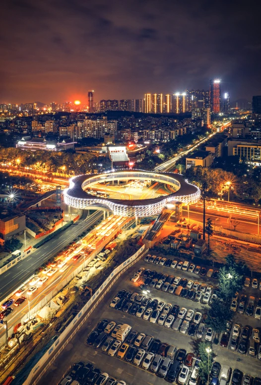 an aerial s of a city and a busy highway at night