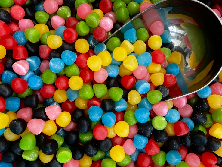 several different colored candy beans in a bowl