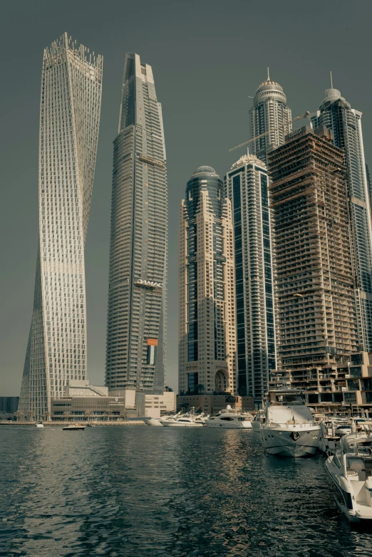 a picture of two buildings along the waters