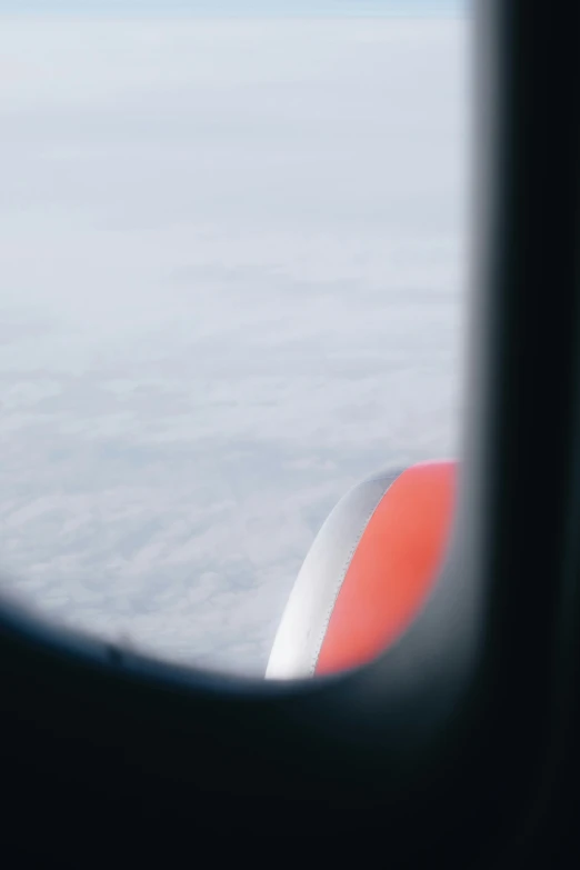 the view from an airplane window shows the wing