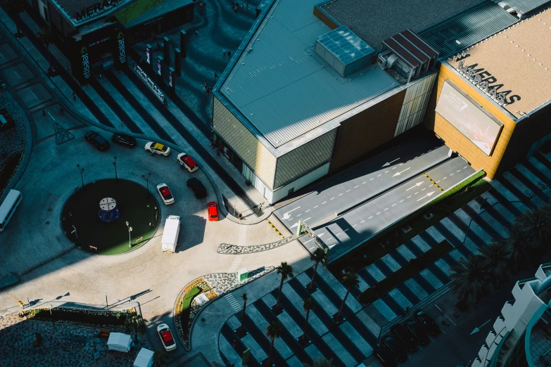 an aerial view of two building that are located in a city