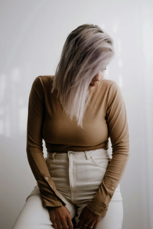 a woman with long white hair and some hair