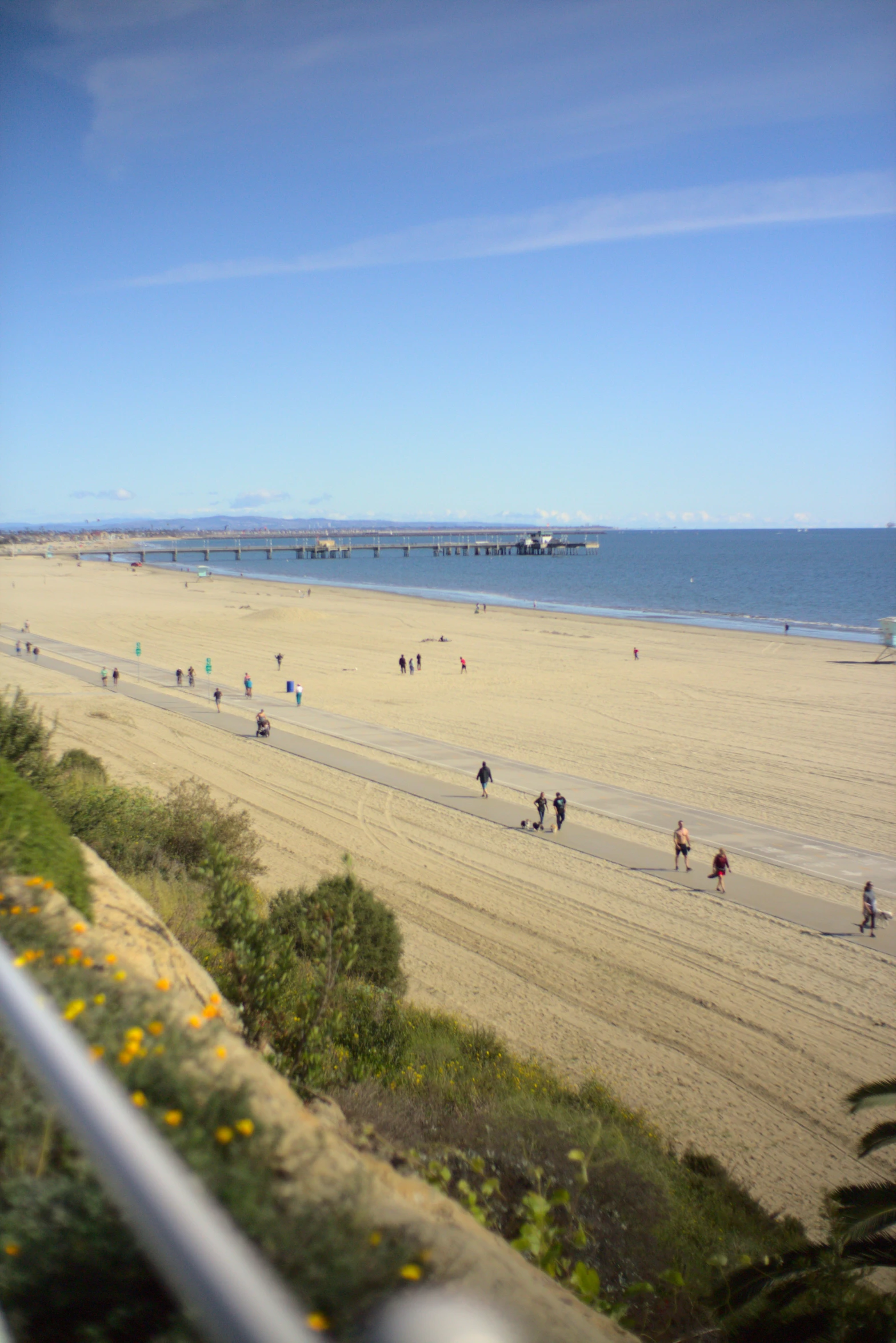 there are many people walking along the beach