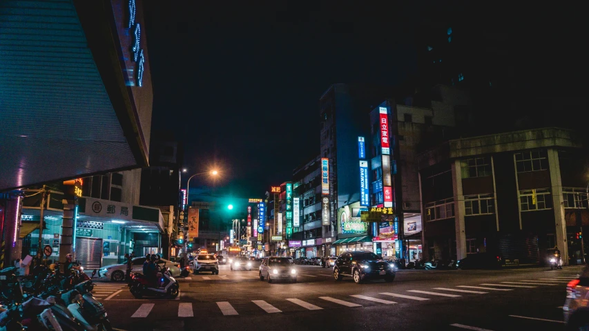 a city street with tall buildings next to traffic