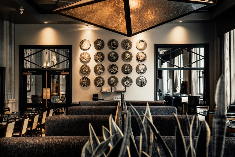 some chairs and tables in a room with decorative plates