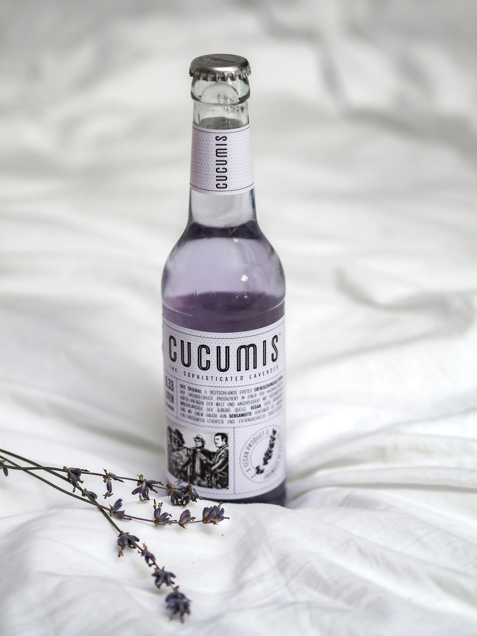 an image of a bottle that is on the bed