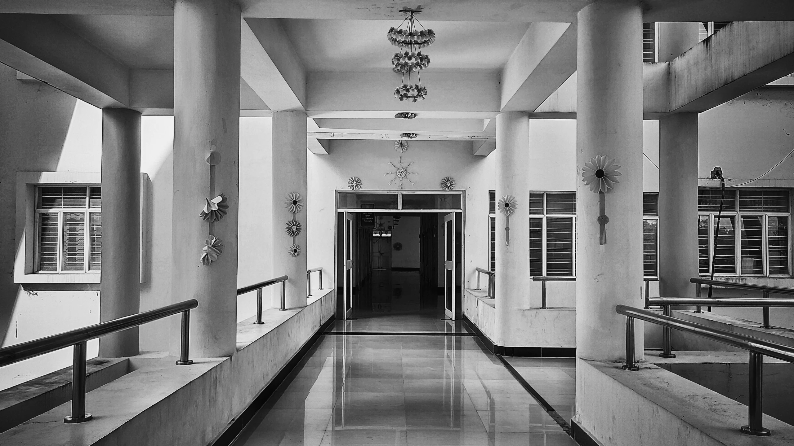 black and white pograph of hallway leading to another room