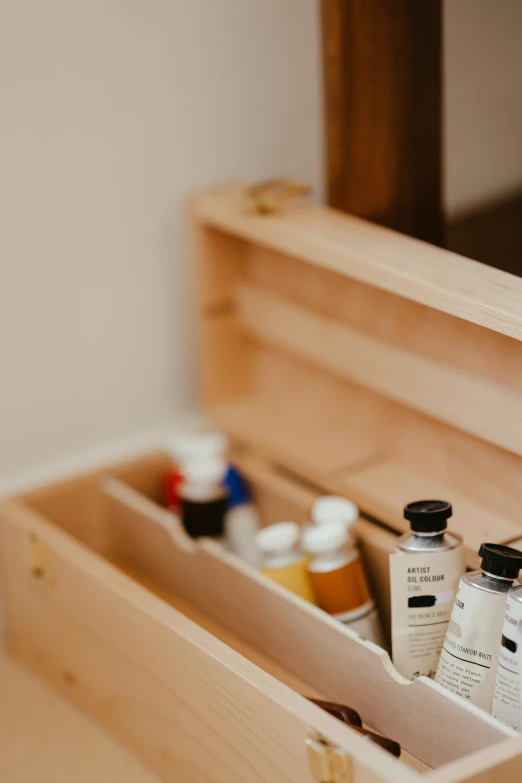 a wooden container filled with various skin care products