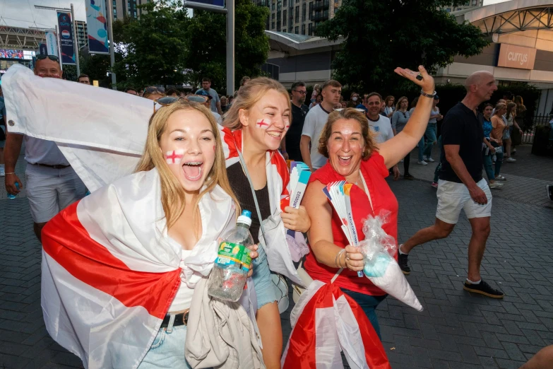 a group of people wearing costume with a flag