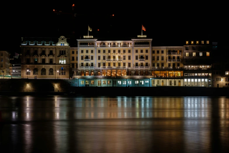 night view of large el buildings with lit up windows