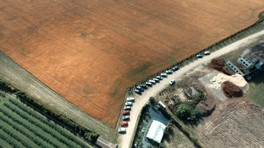 an aerial view of a farm field and houses