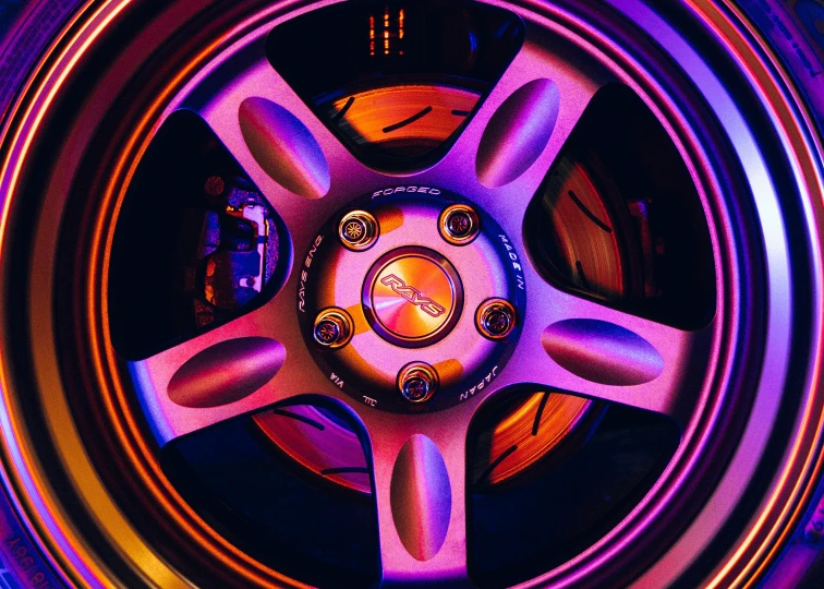 wheel rims, including the center cap and hubs, appear to be purple and red