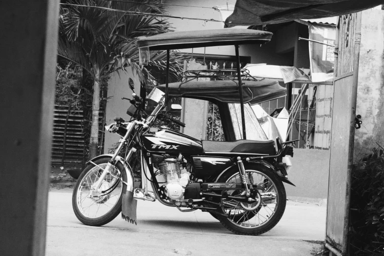 a motor bike is parked by a building