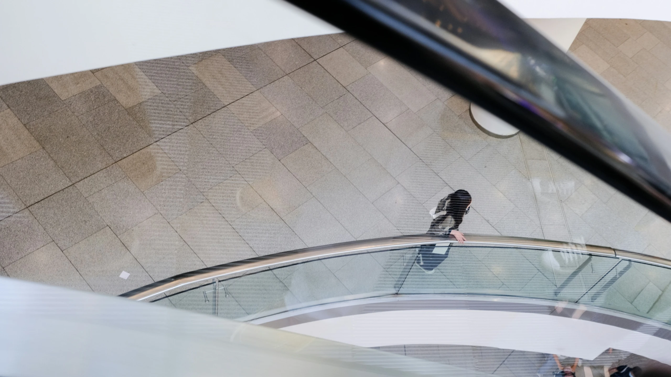 the birds are perched on the glass above the people