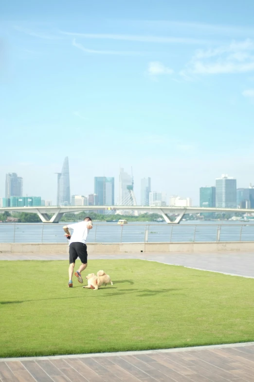 two people in grassy area by the water