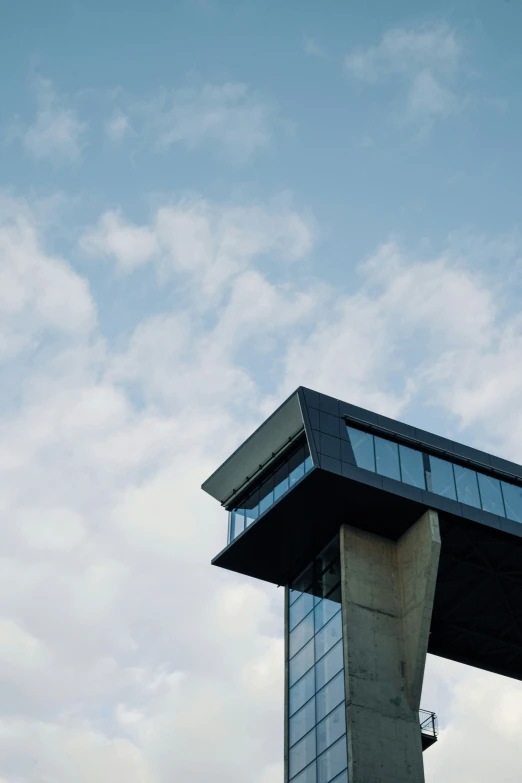 a plane is flying above a tower