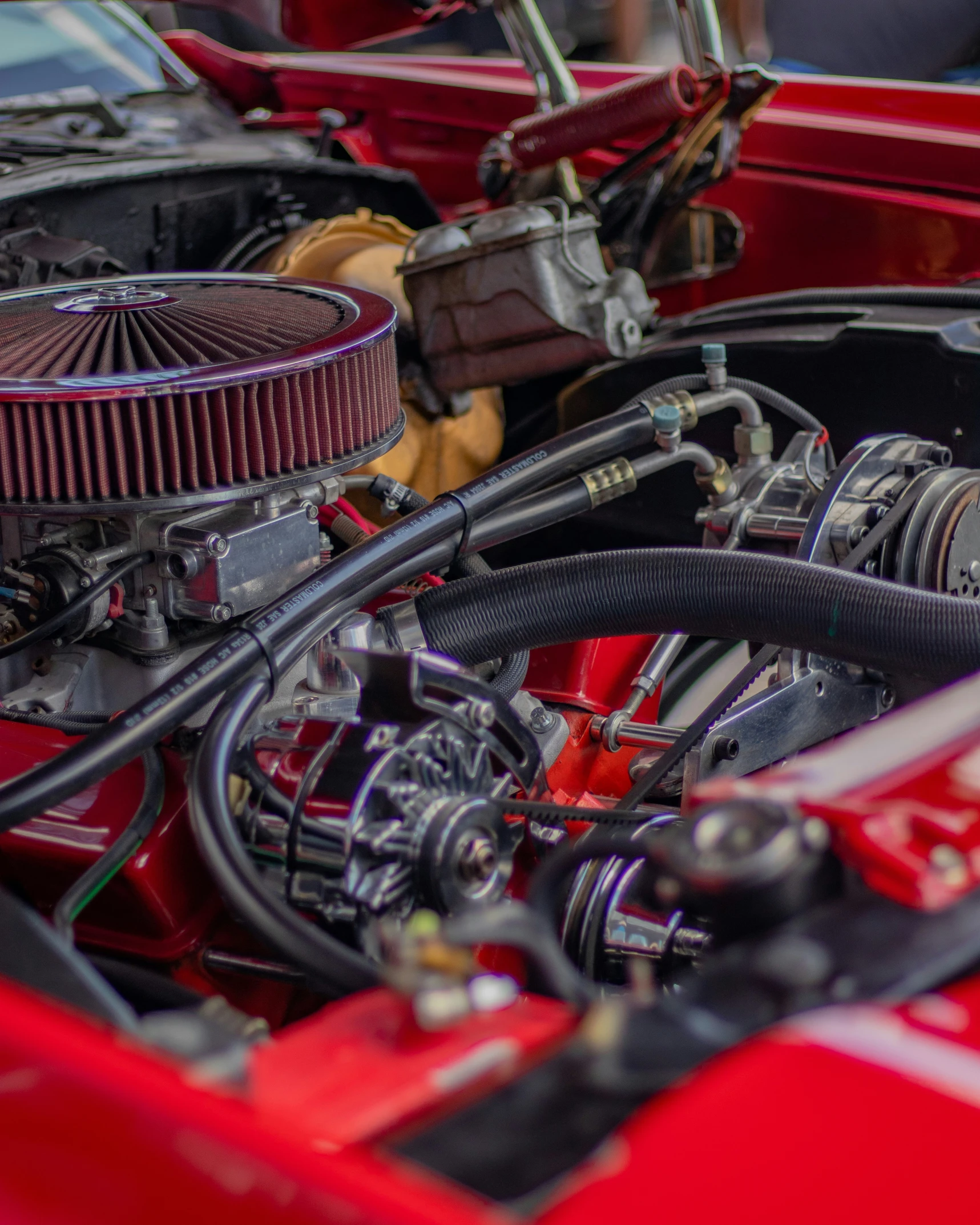 the front view of an older engine in red