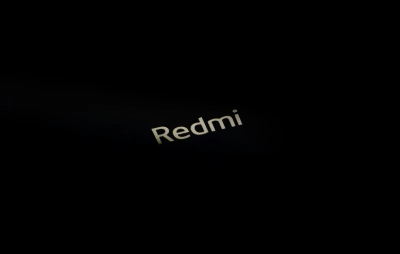 a black image with a redmi logo on it